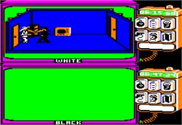 In game image of Spy vs. Spy on the Apple II.