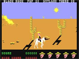 In game image of Outlaws on the Commodore 64.
