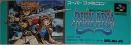 Top of cartridge artwork for Ruin Arm on the Nintendo SNES.