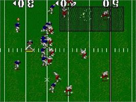 In game image of NCAA Football on the Sega Genesis.