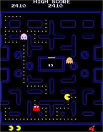 In game image of Puckman on the Arcade.