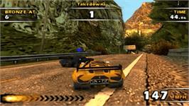 In game image of Burnout Dominator on the Sony PSP.